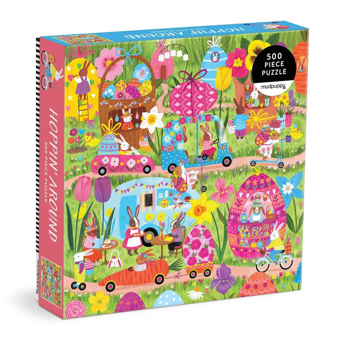 The Hoppin' Around 500 piece jigsaw puzzle by Mudpuppy features a lively outdoor scene of rabbits driving cars and riding bikes—a colorful, flower-filled family puzzle illustrated by Jenny Miriam, perfect for all ages.