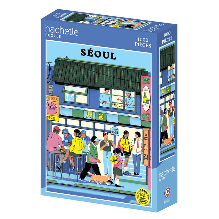 The Hachette Puzzle "Seoul" is a 1,000-piece jigsaw featuring a fagostudio street scene with people and a dog outside a building in Seoul, South Korea. Made in France.